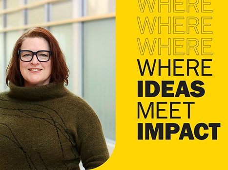 On the left, Dr. Shannon Sterling is wearing a dark green turtle neck sweater, black glasses, and smiling at the camera. On the right, the background is gold and the text 'where ideas meet impact' is displayed in all caps.